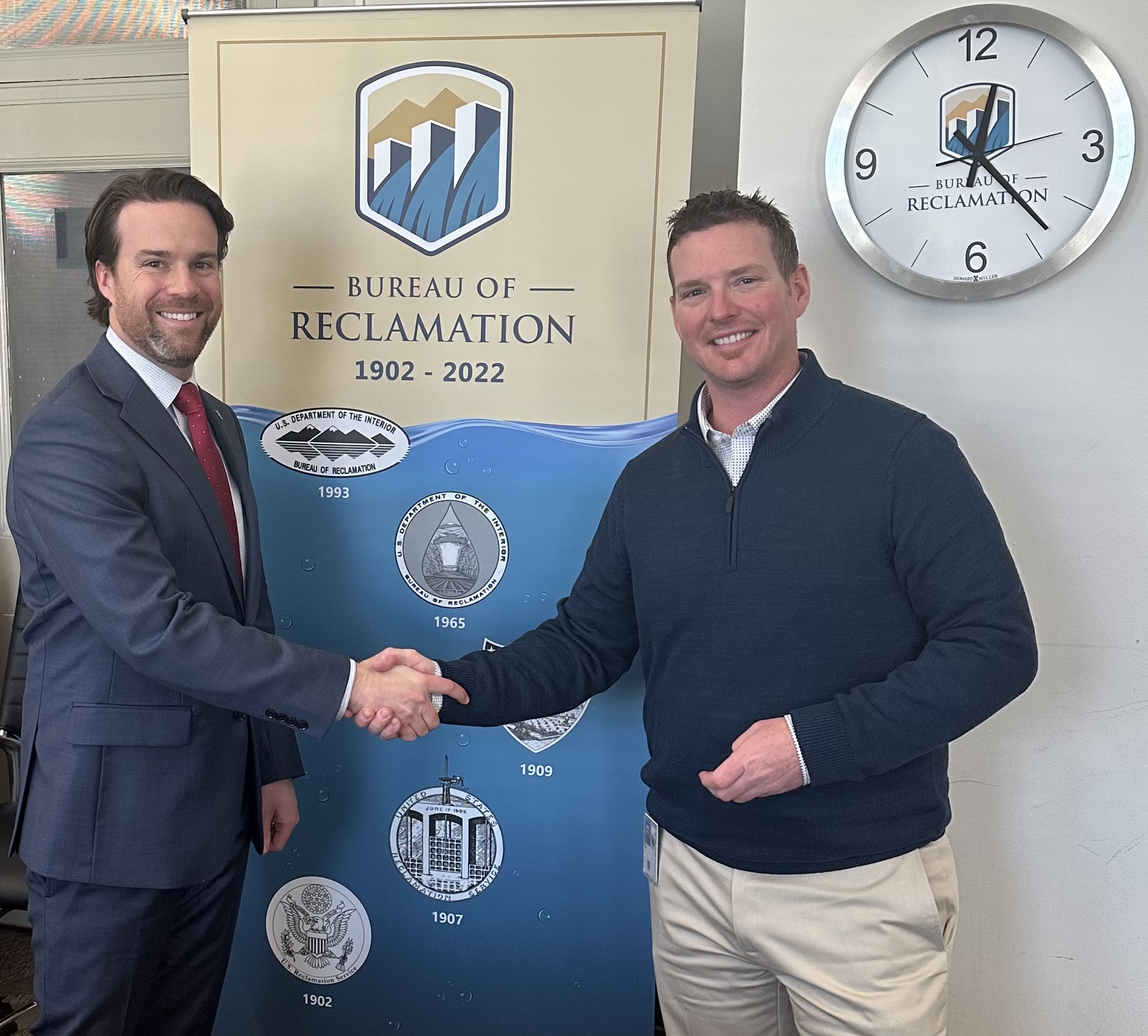 Chad Kidd, P.E., PMP (right) is congratulated by Deputy Commissioner Michael Brain for being selected as the Bureau of Reclamation's Engineer of the Year.